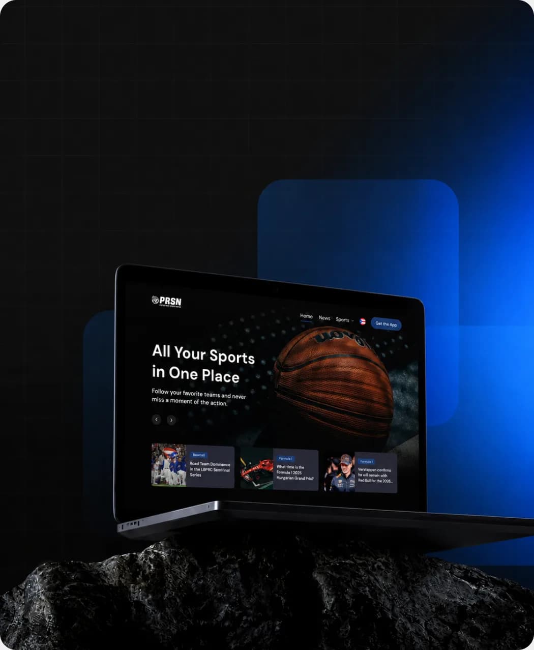 Laptop displaying a sports platform interface design, resting on a rock against a dark blue background